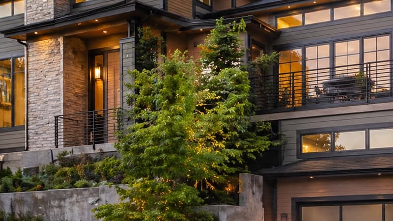 Storybook Kirkland cottage with shingle siding and lush PNW garden